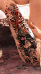 Tatouage du samouraï bouddha sur une jambe