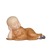 statue moine bouddha couché sur fond blanc