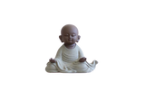 statue de bouddha qui médite sur fond blanc