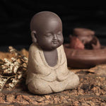 statue du bouddha beige méditant
