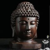 Tête De Bouddha En Bois sur fond noir