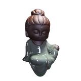 statue bouddha méditation bleu coiffé sur fond blanc