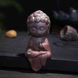 statue bouddha méditation rouge