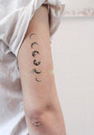 tatouage bouddha de la lune sur un bras