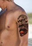 tatouage bouddha fleur sur une épaule