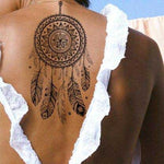 tatouage bouddha le grand attrape rêve sur un dos