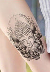 tatouage bouddha lotus sur un mollet