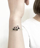 tatouage bouddha panda sur un poignet