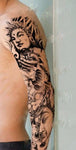 tatouage du bouddha calme sur un bras